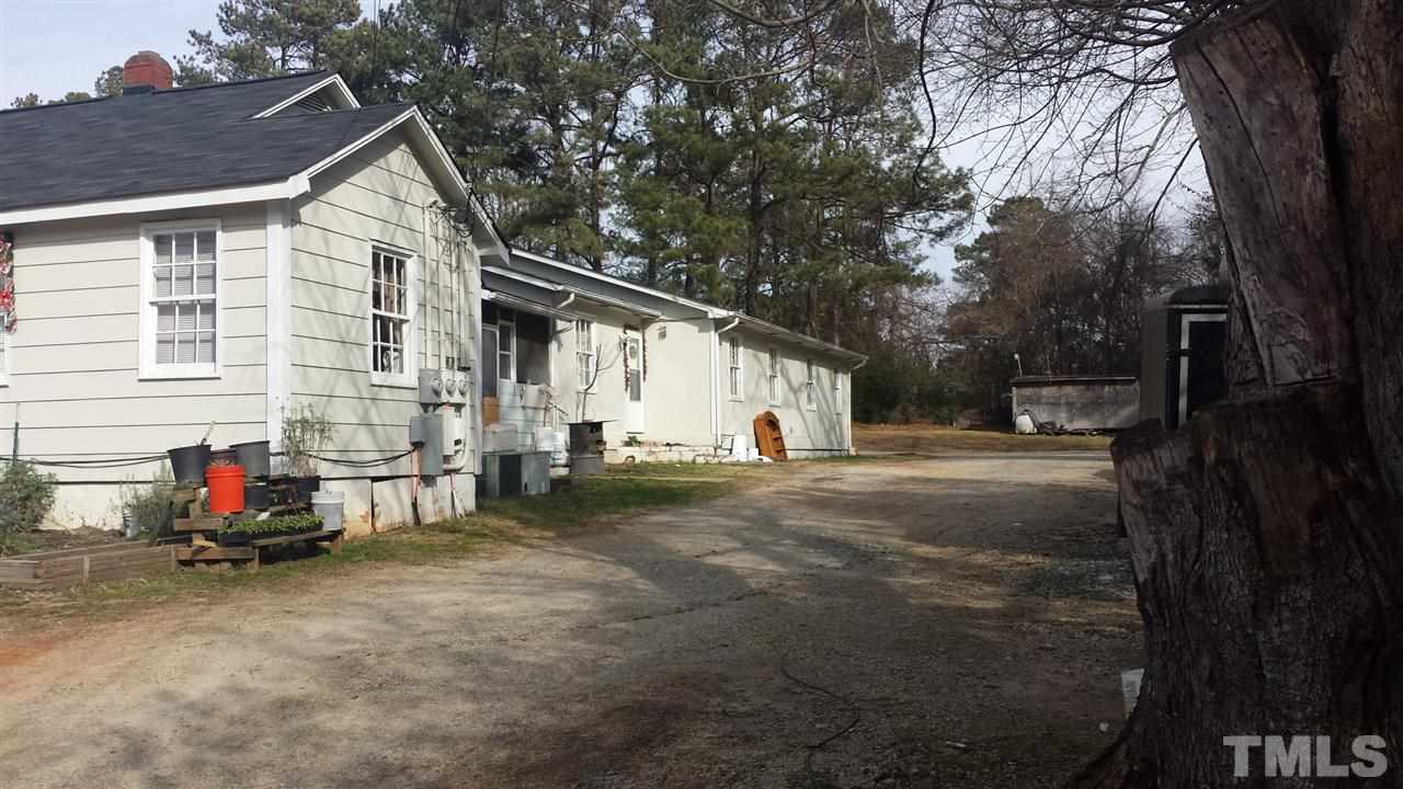 2909 Marion Road Raleigh, NC 27610 - Photo 3 of 10 a view of backyard with wooden fence and large trees