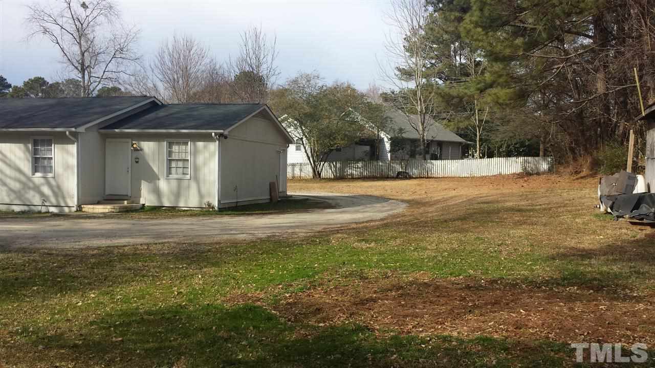 2909 Marion Road Raleigh, NC 27610 - Photo 5 of 10 a front view of a house with a yard and garage