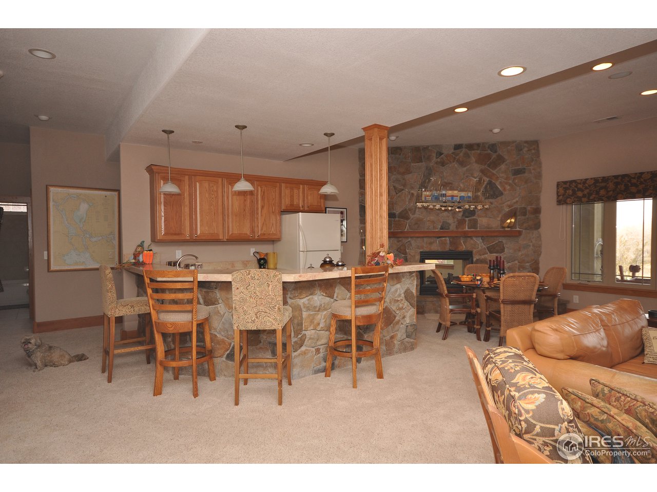 7717 Poudre River Road Greeley, CO 80634 - Photo 18 of 25 bar & fireplace