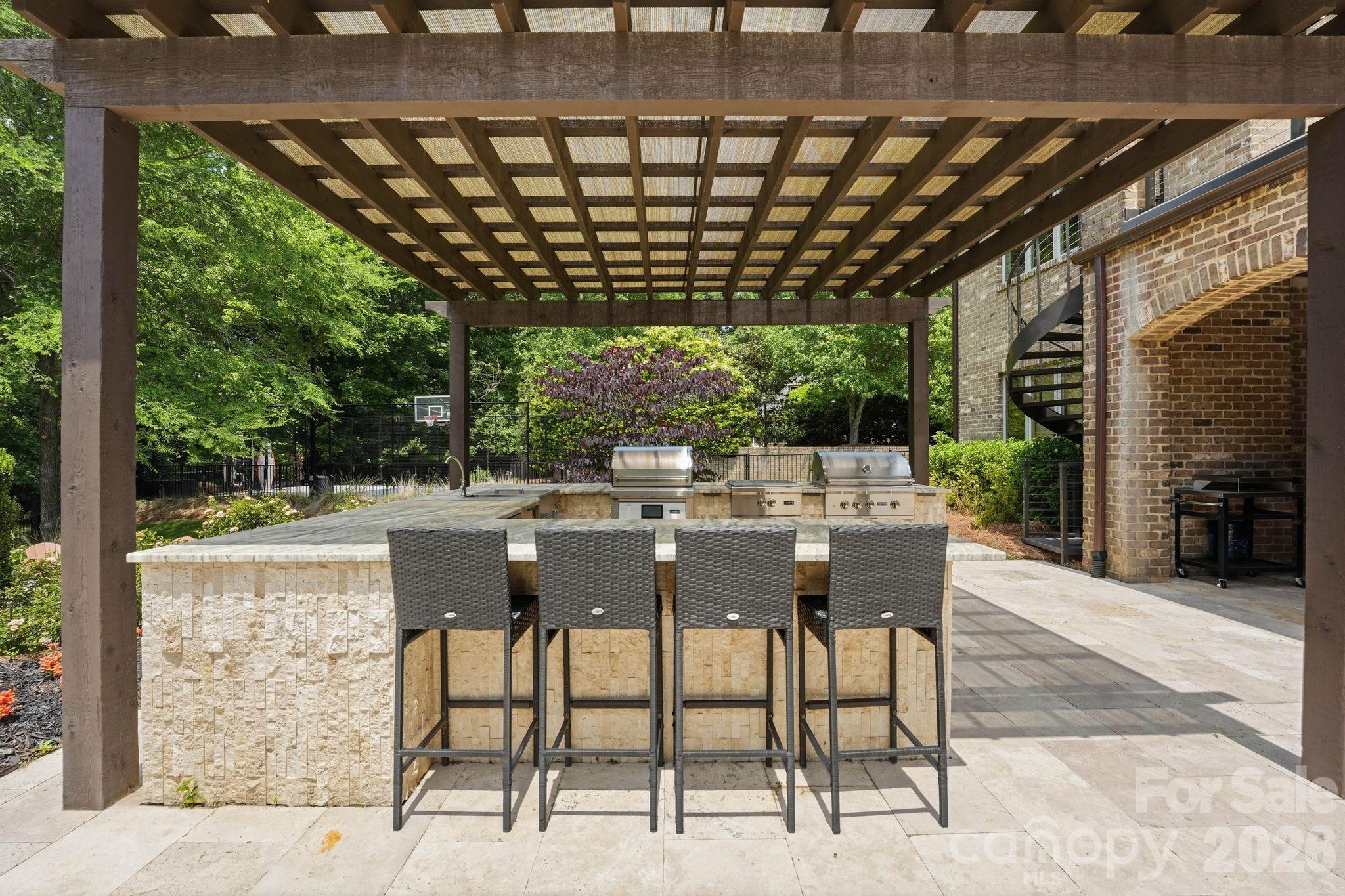 7416 Lee Rea Road Charlotte, NC 28226 - Photo 13 of 48 a view of a patio with table and chairs and potted plants