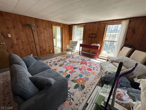 a bedroom with furniture and windows
