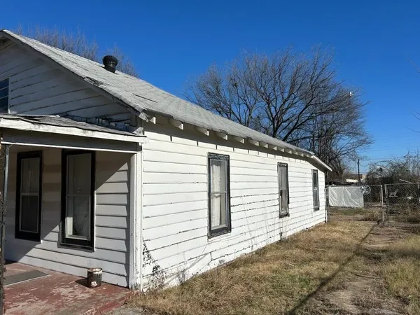 a view of a house with a snow in the yard