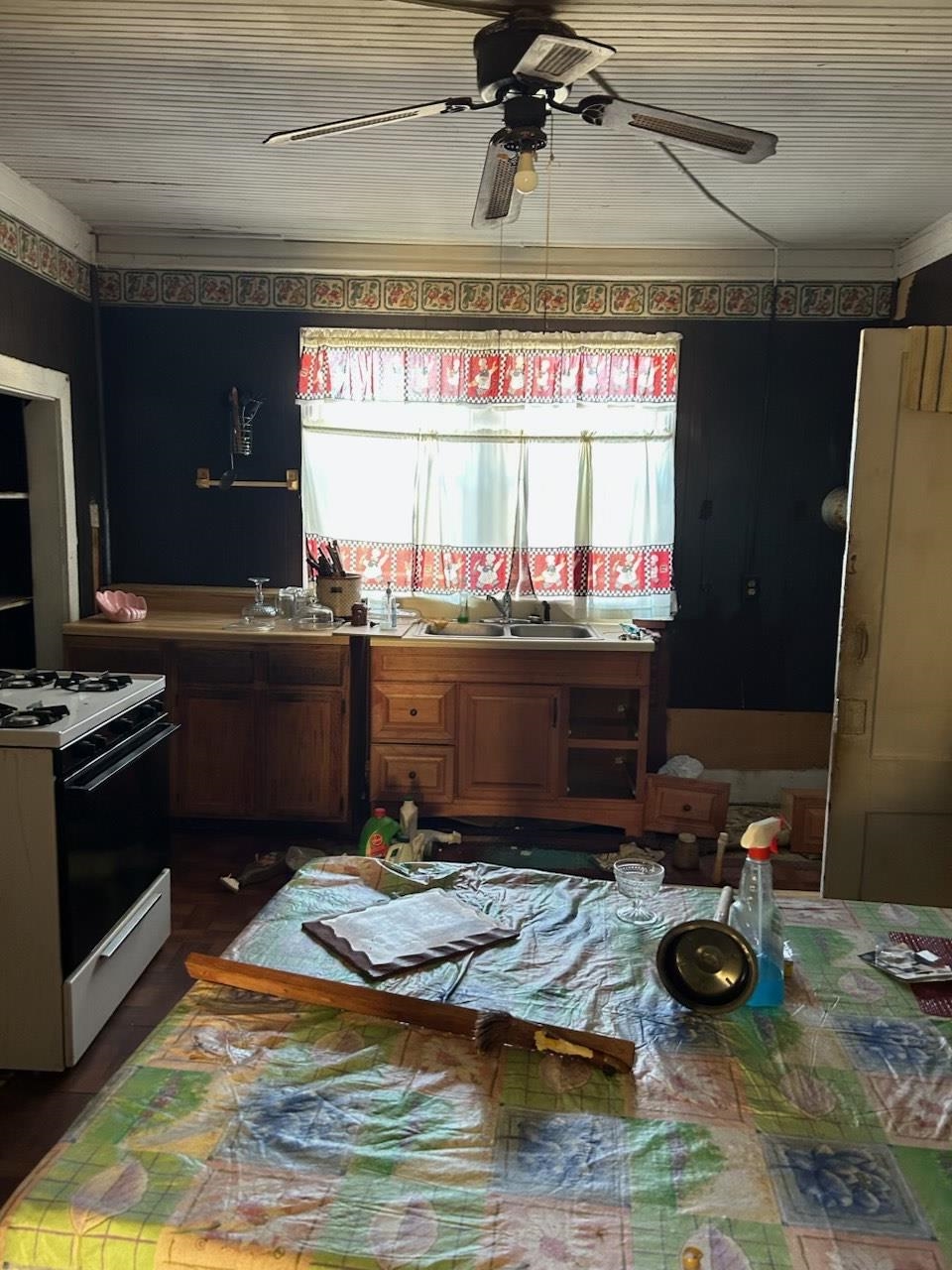 2136 Sparks Street Memphis, TN 38106 - Photo 6 of 8 a kitchen with a stove and a wooden floor