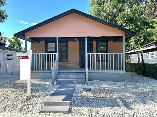 a front view of a house with a porch