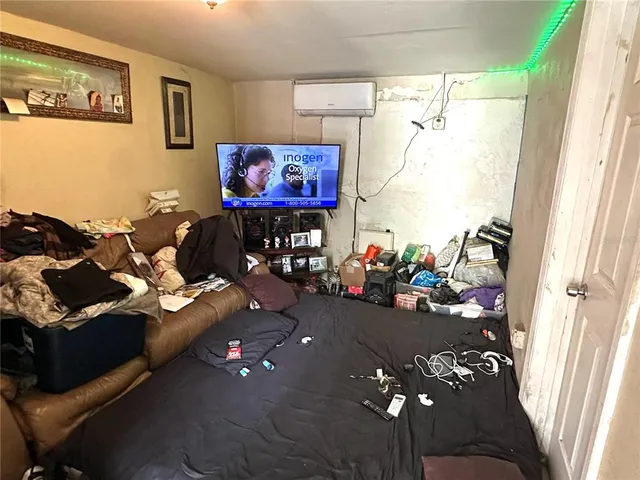 a room with furniture and a flat screen tv