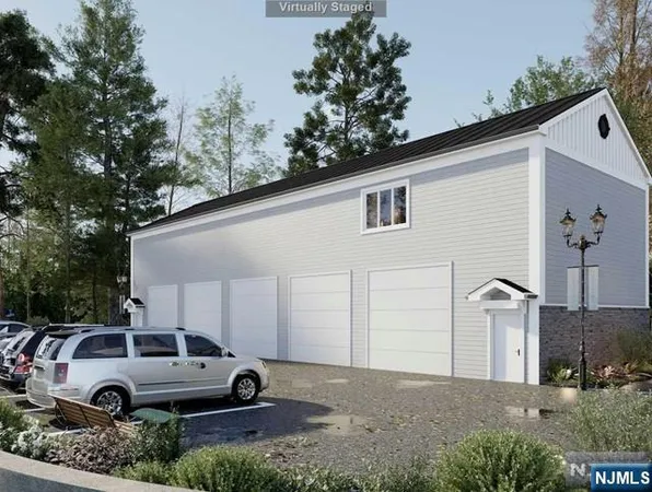 a front view of a house with parking area