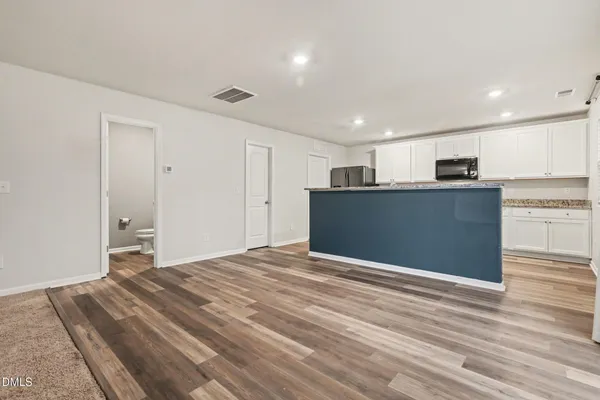 a view of kitchen and wooden floor