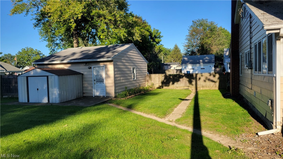 290 Cummings Road Vermilion, OH 44089 - Photo 17 of 18 View of yard featuring a storage shed