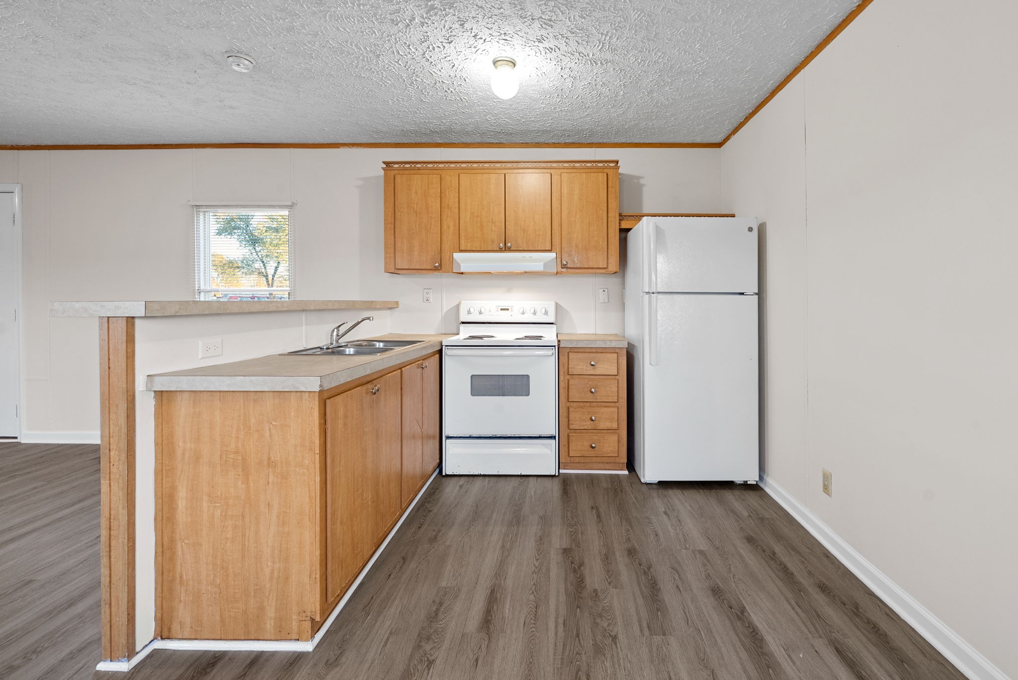 603 Kerri Lane Oak Grove, KY 42262 - Photo 6 of 18 a kitchen with a stove a sink and white appliances