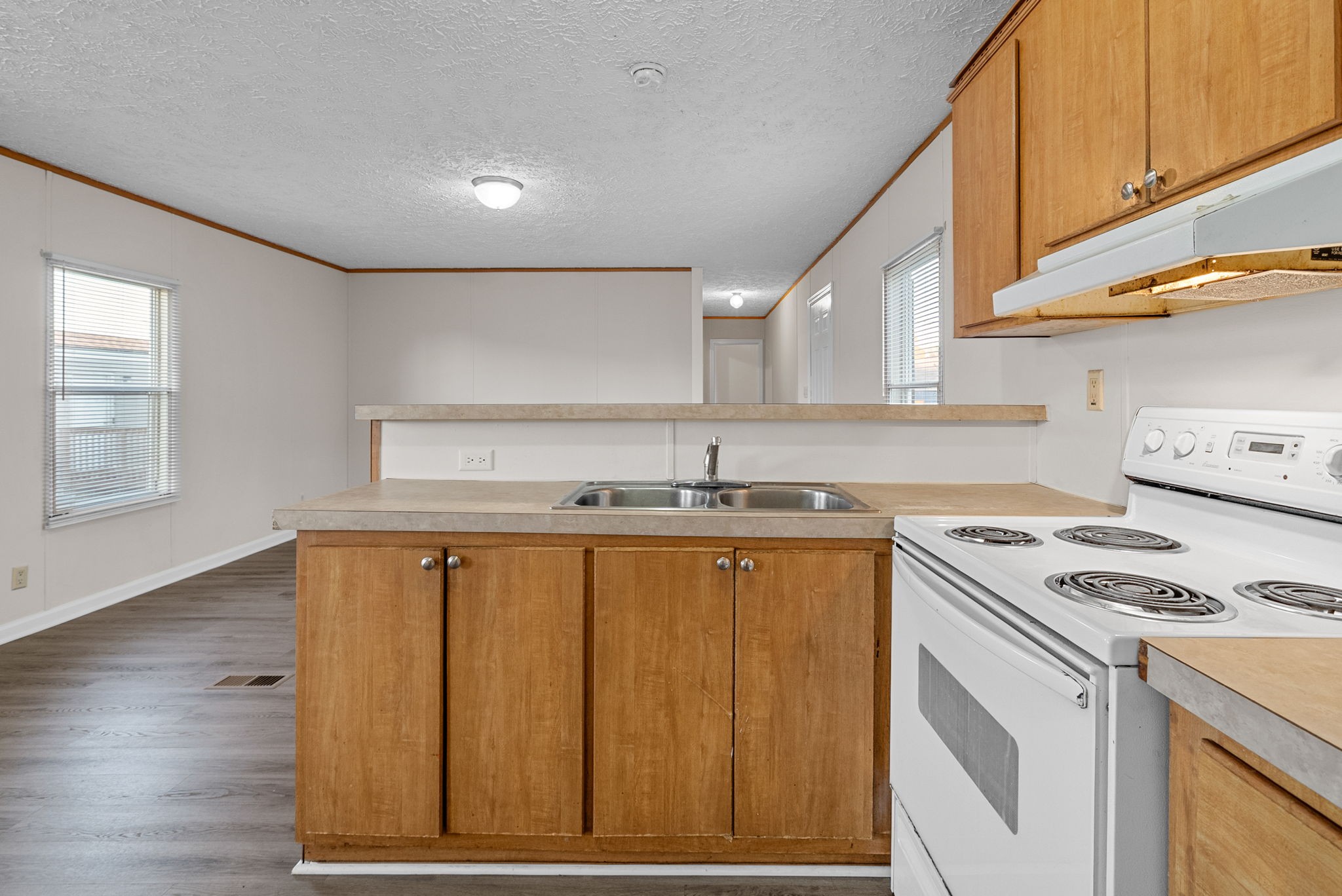603 Kerri Lane Oak Grove, KY 42262 - Photo 7 of 18 a kitchen with a sink cabinets and wooden floor