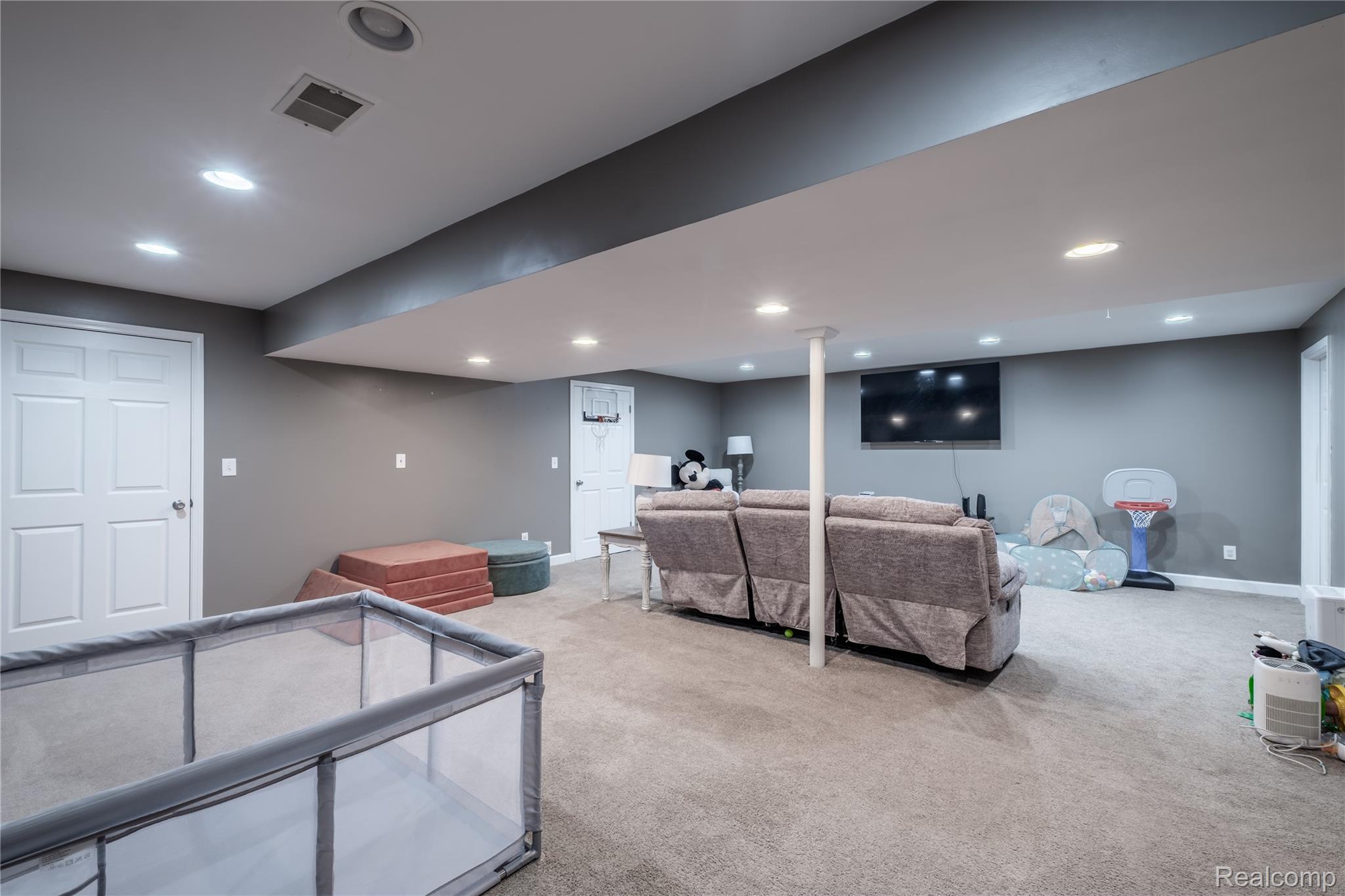10250 Duffield Road Gaines, MI 48436 - Photo 26 of 28 Recessed lighting, light gray walls, white paneled doors, and a carpeted floor