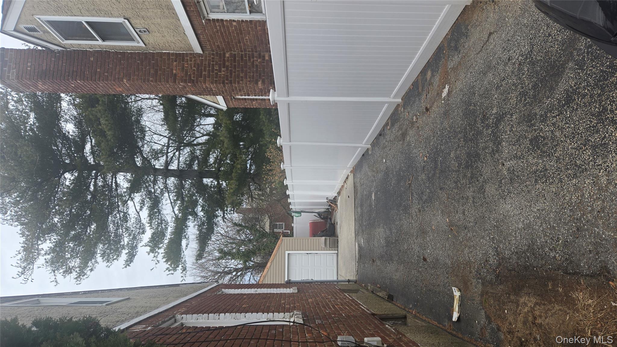 277 Elmont Road Elmont, NY 11003 - Photo 2 of 7 a view of a house with a yard