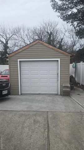 a view of garage and a car parked in it