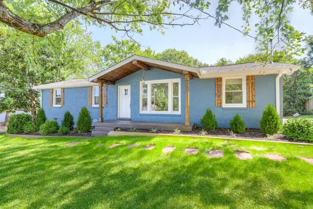 a house that has a big yard in front of it