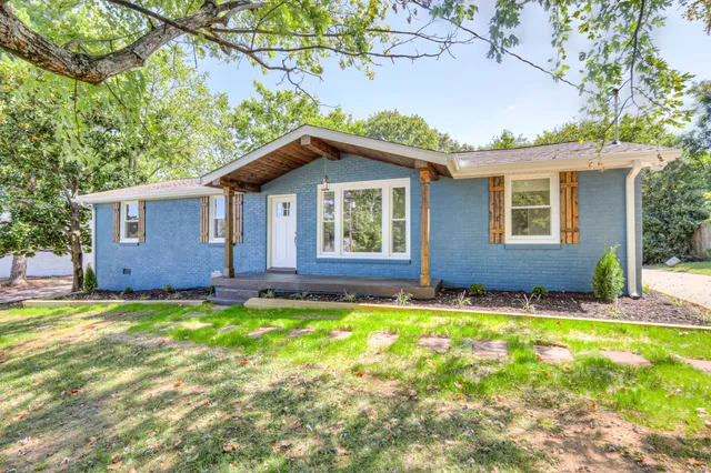 a house that has a big yard in front of it