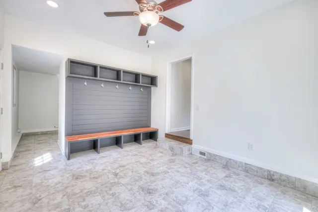 a view of room with window and ceiling fan