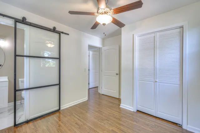 a bathroom with a toilet sink shower and mirror