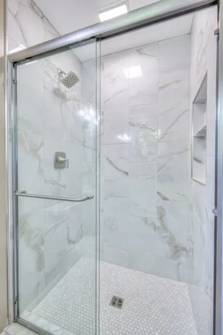 a view of patio with a table and chairs under an umbrella