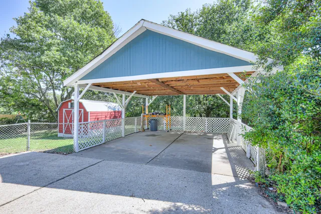 a view of patio with wooden fence