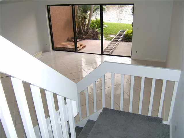 a view of a porch with wooden floor