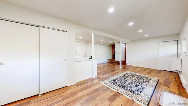 a view of an empty room and a window