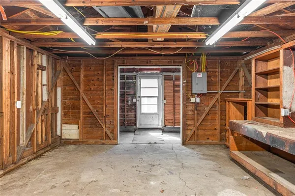 a view of empty room with wooden ceiling