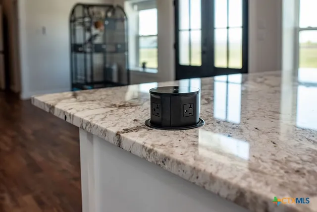 a stove top oven sitting inside of a kitchen