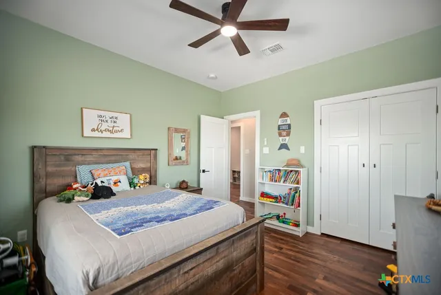 a bed room with a bed and a window