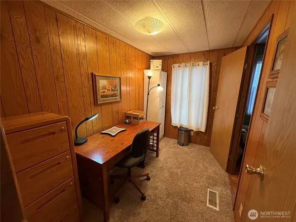 a room with chairs and furniture