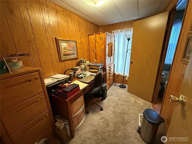 a room with chairs and a gate