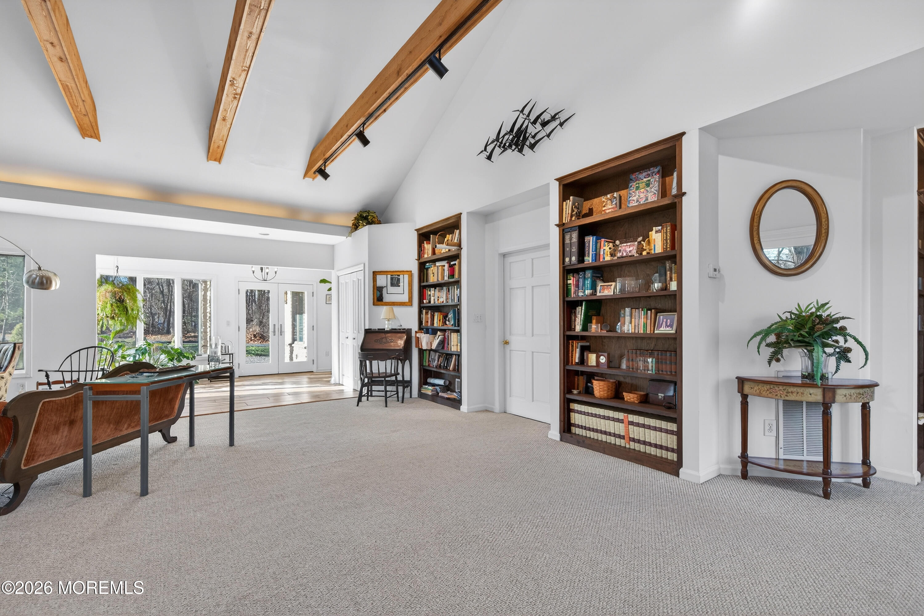 184 Smithburg Road Manalapan, NJ 07726 - Photo 26 of 45 a view of a livingroom with furniture and a bookshelf