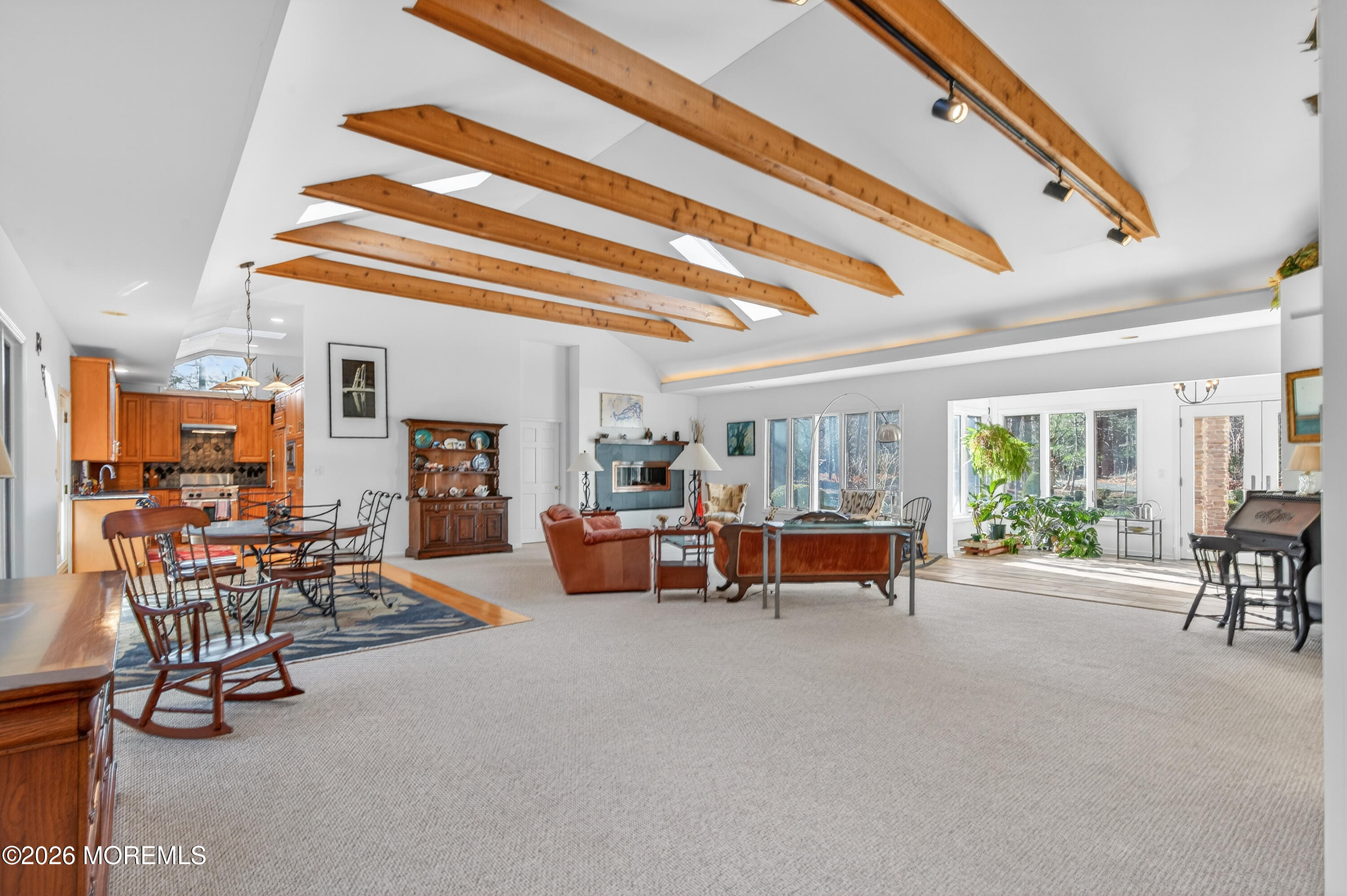 184 Smithburg Road Manalapan, NJ 07726 - Photo 27 of 45 a living room with furniture and a chandelier