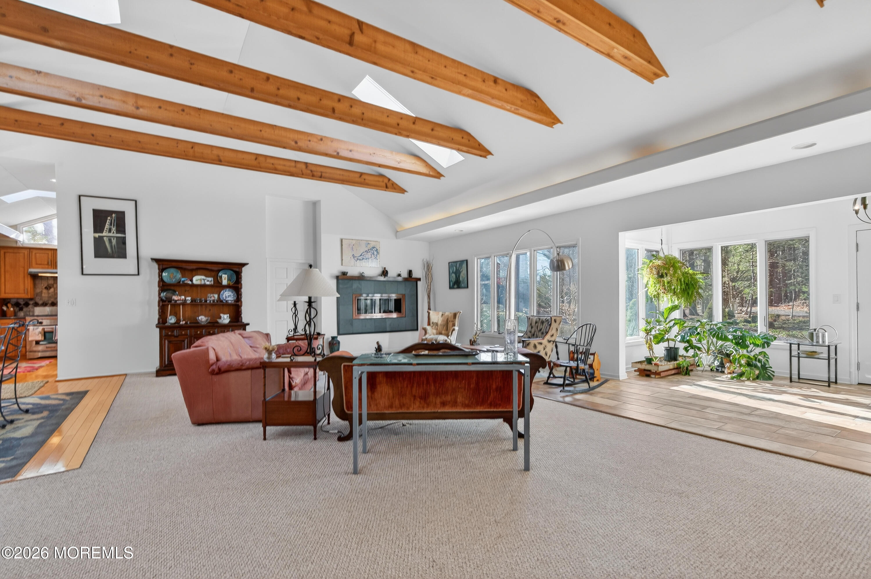 184 Smithburg Road Manalapan, NJ 07726 - Photo 28 of 45 a living room with furniture and a chandelier