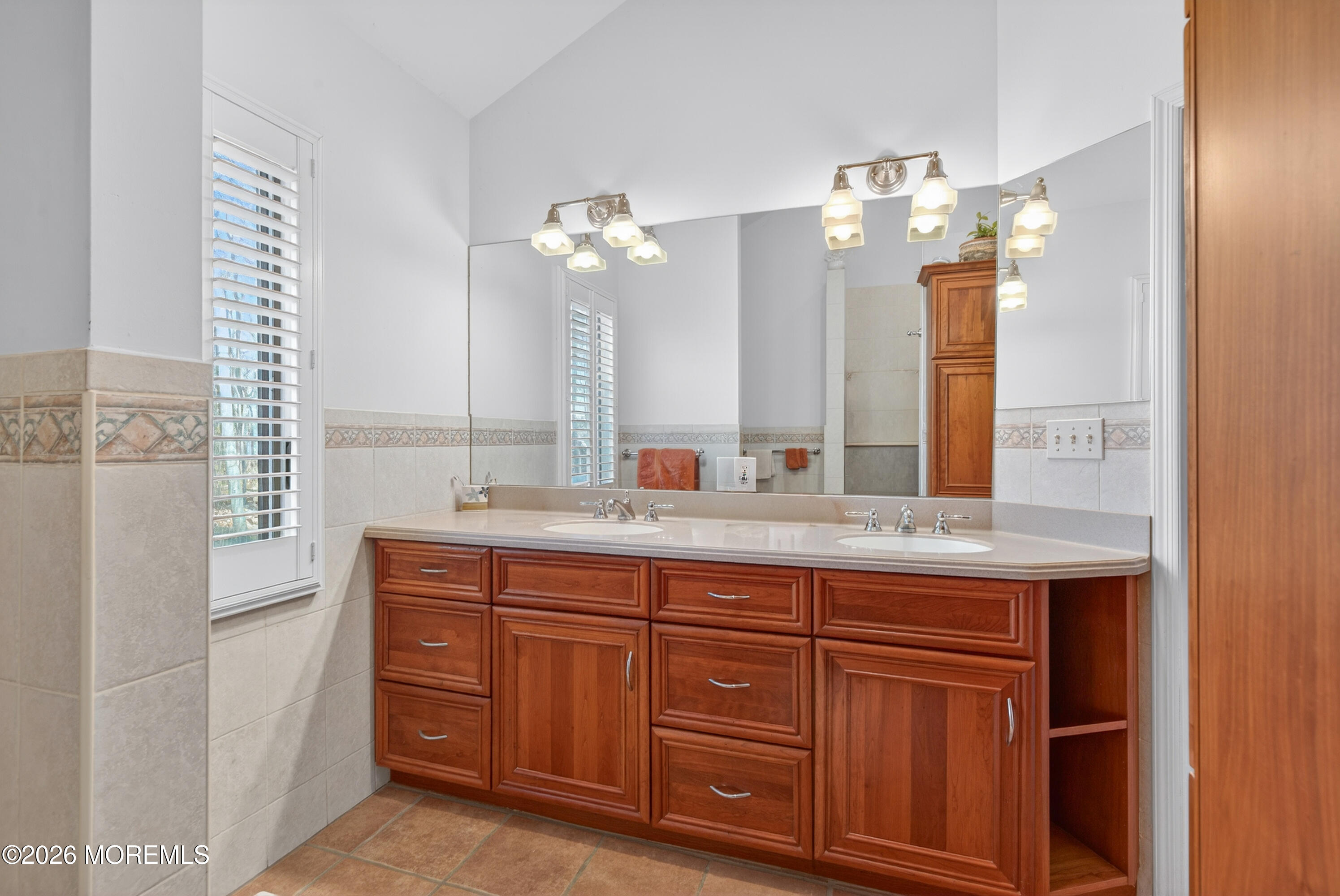 184 Smithburg Road Manalapan, NJ 07726 - Photo 37 of 45 a bathroom with a granite countertop double vanity sink and a mirror