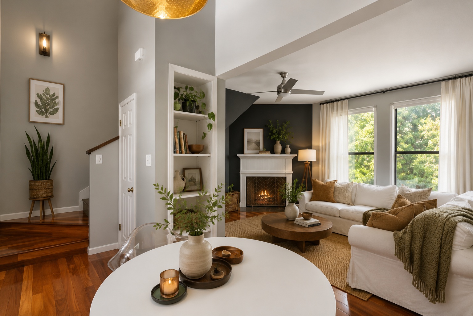 611 East 45th Street, Unit 25 Austin, TX 78751 - Photo 10 of 21 Open-concept living area featuring rich wood-finish flooring, a white mantel fireplace, and built-in shelving