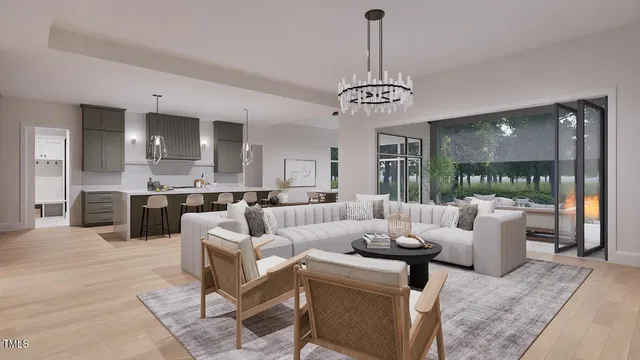 a living room with furniture a chandelier and a view of kitchen