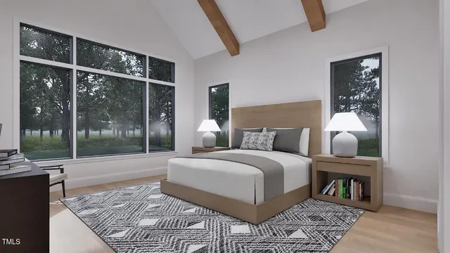 a bedroom with a large bed and a large window