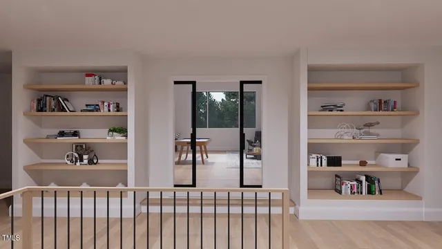 a bedroom with furniture and a book shelf
