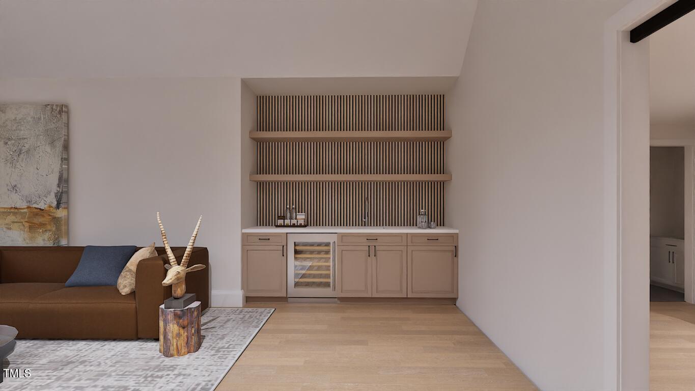 962 Shelley Road Raleigh, NC 27609 - Photo 21 of 34 a living room with a couch and a stove top oven
