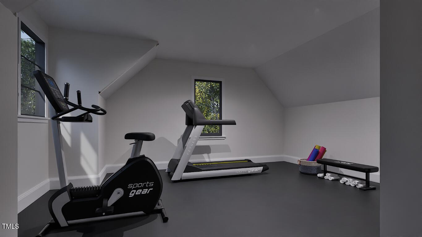 962 Shelley Road Raleigh, NC 27609 - Photo 23 of 34 a room with gym equipment and wooden floor