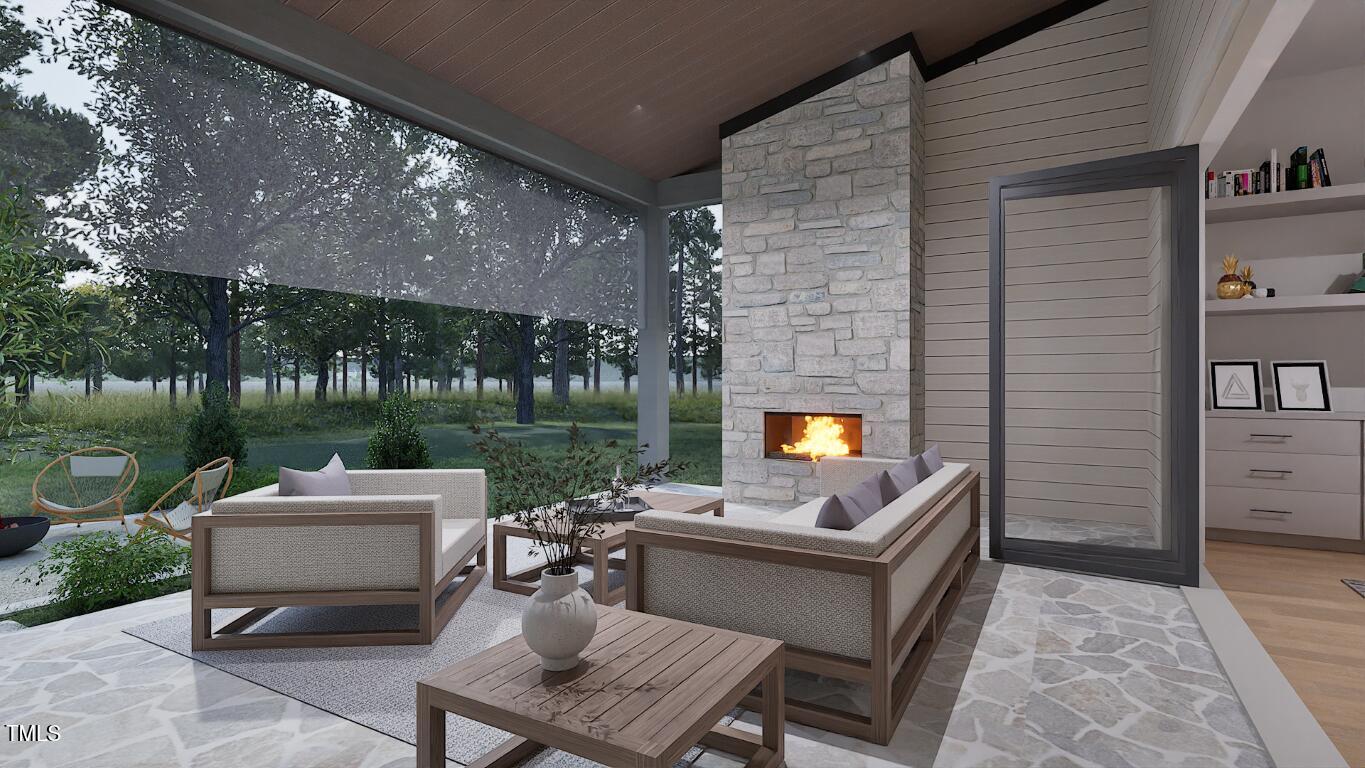 962 Shelley Road Raleigh, NC 27609 - Photo 29 of 34 a outdoor living space with patio furniture and a fireplace