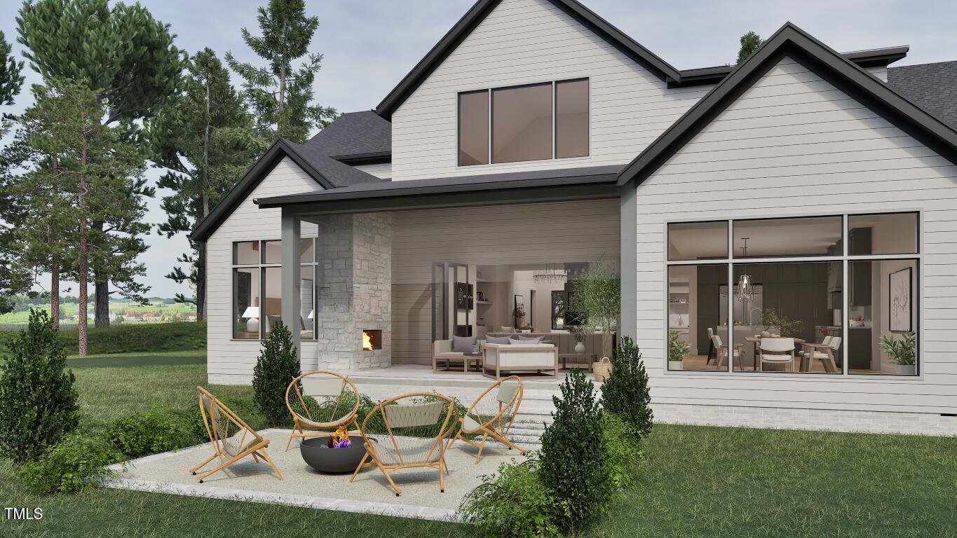962 Shelley Road Raleigh, NC 27609 - Photo 32 of 34 a view of a house with backyard porch and garden