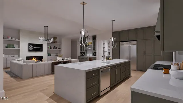 a kitchen with sink a refrigerator and chairs