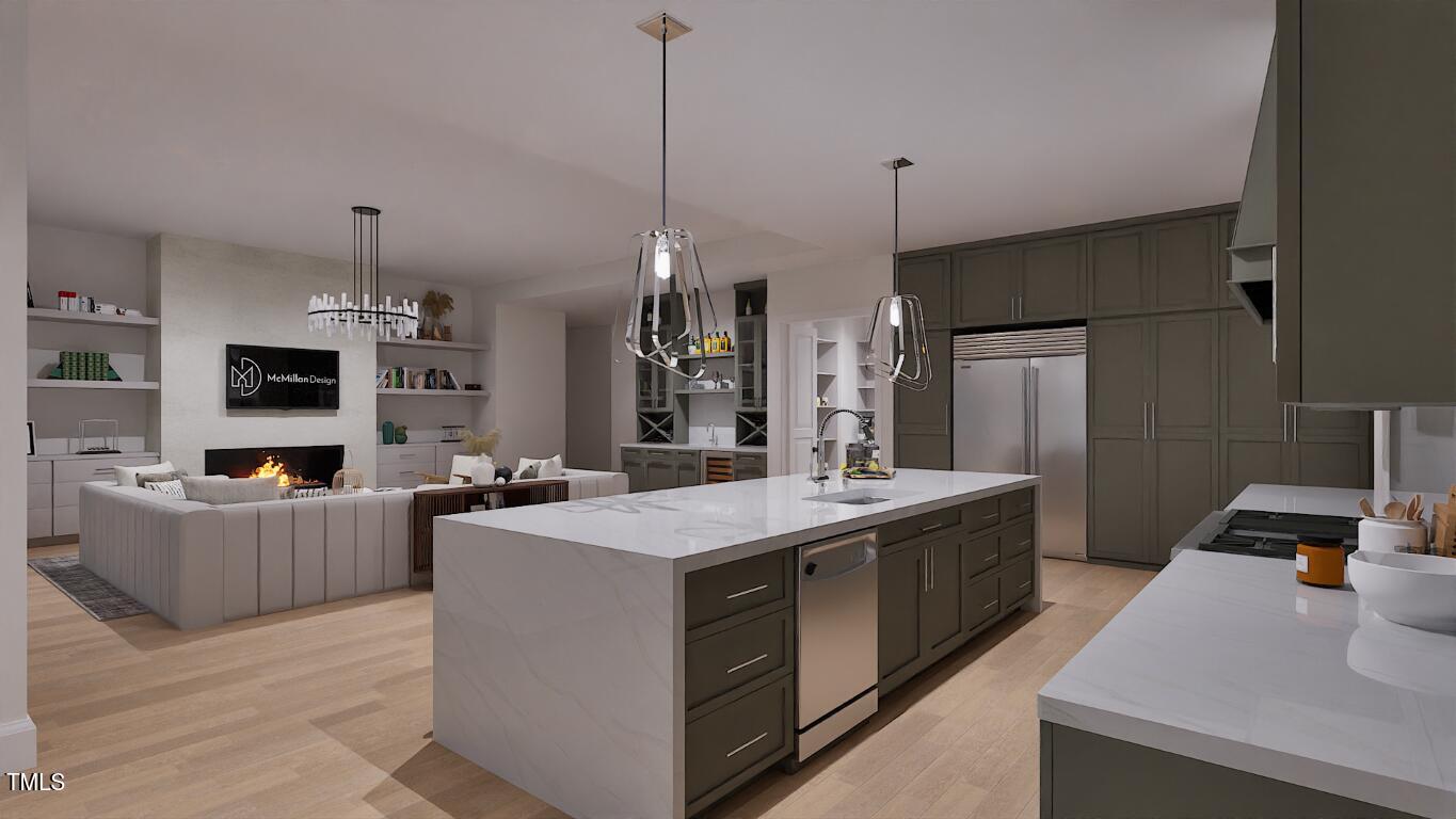 962 Shelley Road Raleigh, NC 27609 - Photo 5 of 34 a kitchen with sink a refrigerator and chairs