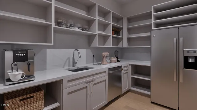 a view of cabinets a washer and dryer