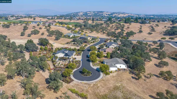 an aerial view of a house with a lake view
