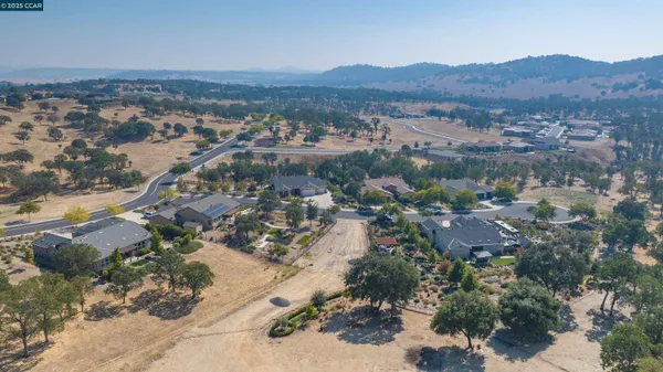 an aerial view of residential house and green space