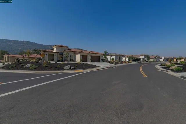 a view of a city street with cars