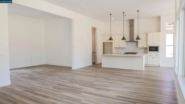 a view of kitchen with wooden floor