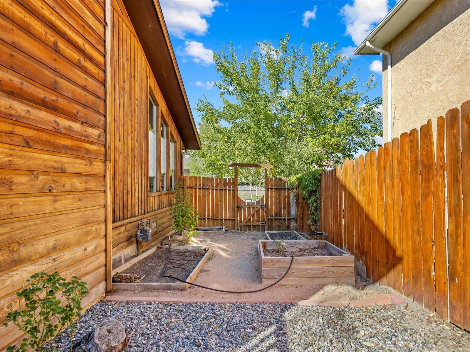 2369 1/2 Rana Road Grand Junction, CO 81507 - Photo 24 of 33 The side of the home has more planters with opport